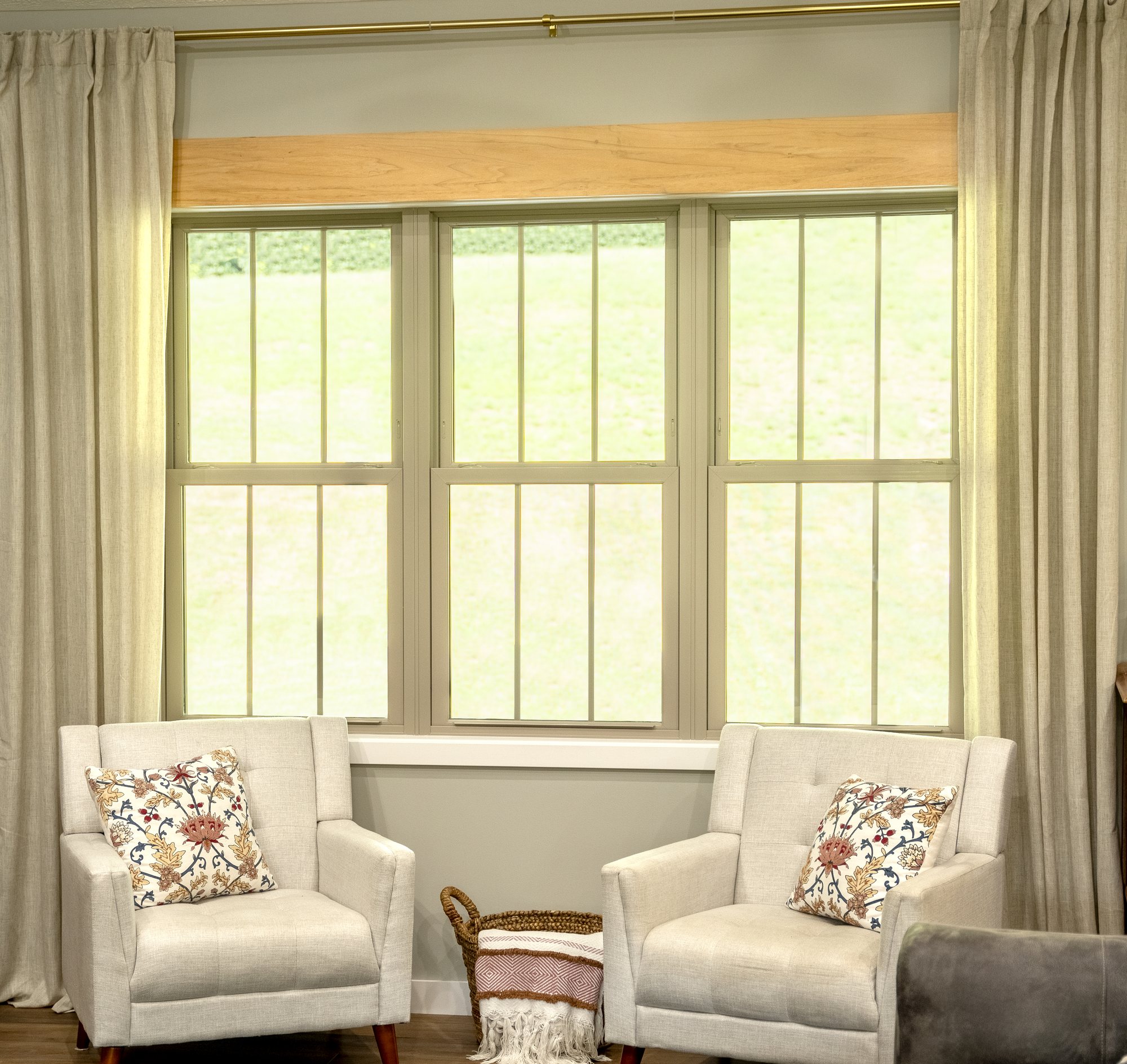Living room with three sandstone double-hung replacement windows